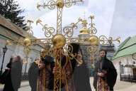 Blessing of cross at Trinity Gate Church in Kyiv