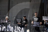 Protesters Demonstrate Outside Elite Law Firm Over Deal With Trump 