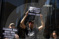 Protesters Demonstrate Outside Elite Law Firm Over Deal With Trump 