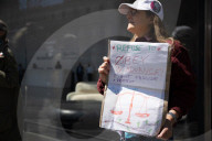 Protesters Demonstrate Outside Elite Law Firm Over Deal With Trump 