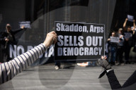 Protesters Demonstrate Outside Elite Law Firm Over Deal With Trump 