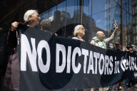Protesters Demonstrate Outside Elite Law Firm Over Deal With Trump 