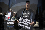 Protesters Demonstrate Outside Elite Law Firm Over Deal With Trump 