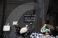 Protesters Demonstrate Outside Elite Law Firm Over Deal With Trump 