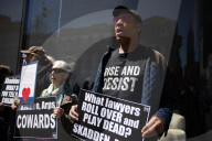 Protesters Demonstrate Outside Elite Law Firm Over Deal With Trump 