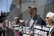 Protesters Demonstrate Outside Elite Law Firm Over Deal With Trump 
