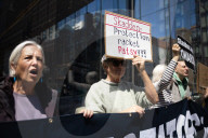 Protesters Demonstrate Outside Elite Law Firm Over Deal With Trump 