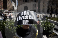 Protesters Demonstrate Outside Elite Law Firm Over Deal With Trump 