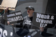 Protesters Demonstrate Outside Elite Law Firm Over Deal With Trump 