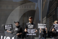 Protesters Demonstrate Outside Elite Law Firm Over Deal With Trump 
