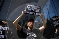Protesters Demonstrate Outside Elite Law Firm Over Deal With Trump 
