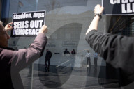 Protesters Demonstrate Outside Elite Law Firm Over Deal With Trump 