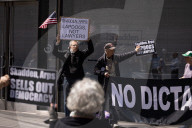 Protesters Demonstrate Outside Elite Law Firm Over Deal With Trump 