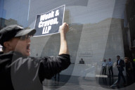 Protesters Demonstrate Outside Elite Law Firm Over Deal With Trump 