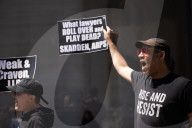 Protesters Demonstrate Outside Elite Law Firm Over Deal With Trump 
