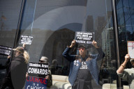 Protesters Demonstrate Outside Elite Law Firm Over Deal With Trump 