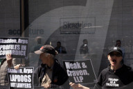 Protesters Demonstrate Outside Elite Law Firm Over Deal With Trump 