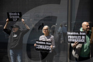 Protesters Demonstrate Outside Elite Law Firm Over Deal With Trump 
