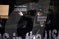 Protesters Demonstrate Outside Elite Law Firm Over Deal With Trump 