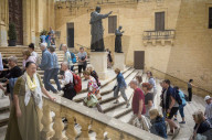 Tourists explore Victoria Citadel and its panoramic views over the island of Gozo