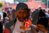Catholic Faithful Light Candles At Easter Vigil Procession In Nepal.