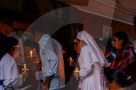 Catholic Faithful Light Candles At Easter Vigil Procession In Nepal.
