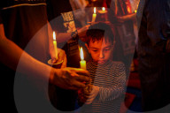 Catholic Faithful Light Candles At Easter Vigil Procession In Nepal.