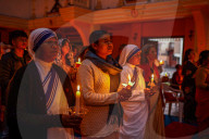 Catholic Faithful Light Candles At Easter Vigil Procession In Nepal.