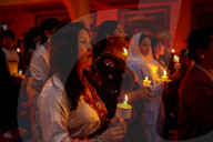 Catholic Faithful Light Candles At Easter Vigil Procession In Nepal.