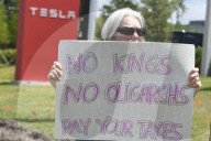 Protesteis In Front Of A Tesla Store