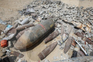 Gazans in tents near military remnants