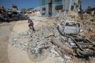 Gazans in tents near military remnants