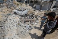 Gazans in tents near military remnants