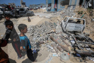 Gazans in tents near military remnants