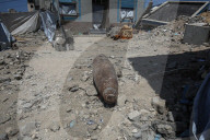 Gazans in tents near military remnants
