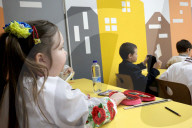 Ukrainian children forced to learn underground as Russia targets civilians