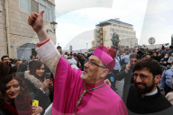 Pierbattista Pizzaballa, the Latin Patriarch of Jerusalem, greets people as he arrives to attend Christmas celebrations in Bethlehem, in the West Bank
