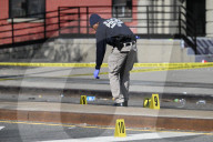 61-year-old Woman Fatally Shot To The Head And A 23-year-old Man Wounded After Being Shot To The Foot At West 113 Street And Lenox Avenue In Harlem, Manhattan, New York
