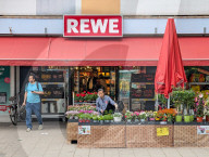 REWE Supermarket Storefront With Outdoor Flower Display