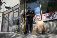 61-year-old Woman Fatally Shot To The Head And A 23-year-old Man Wounded After Being Shot To The Foot At West 113 Street And Lenox Avenue In Harlem, Manhattan, New York