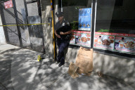 61-year-old Woman Fatally Shot To The Head And A 23-year-old Man Wounded After Being Shot To The Foot At West 113 Street And Lenox Avenue In Harlem, Manhattan, New York