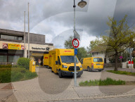 DHL Operations By A Post Office And DHL Packstation