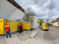 DHL Operations By A Post Office And DHL Packstation