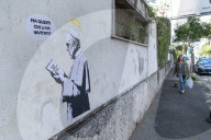 Rome, Mural entitled “The Guests” created by the street artist Laika