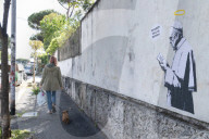 Rome, Mural entitled “The Guests” created by the street artist Laika