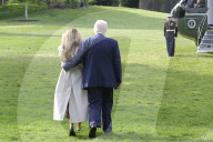 DC: President Trump and First Lady Melania Trump hold a White House departure