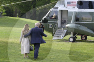 DC: President Trump and First Lady Melania Trump hold a White House departure
