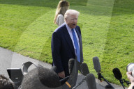 DC: President Trump and First Lady Melania Trump hold a White House departure