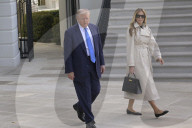 DC: President Trump and First Lady Melania Trump hold a White House departure