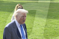 DC: President Trump and First Lady Melania Trump hold a White House departure